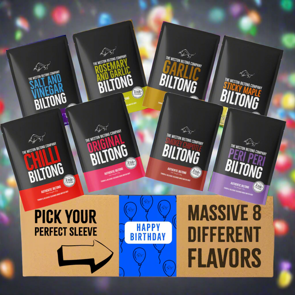 Assorted biltong packages with different flavors displayed in front of a cardboard box.