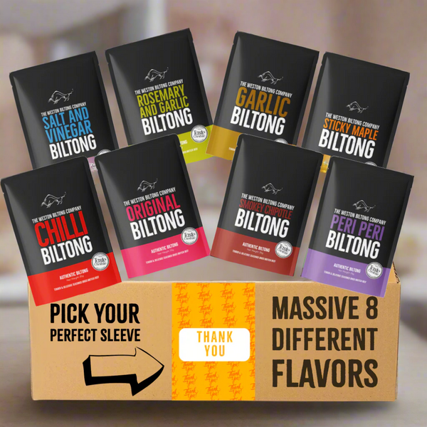 Assorted biltong packages in front of a cardboard box with text and branding. A Thank you gift idea